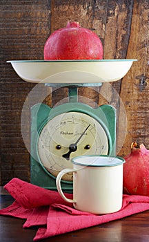 Vintage kitchen scales and tin cups and pans