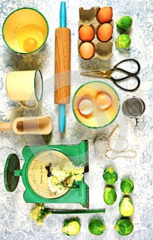 Vintage kitchenware creative layout top view on white textured background.