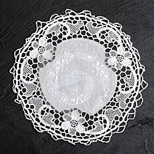 Vintage knitted napkin. White handmade knitted coaster lace doily