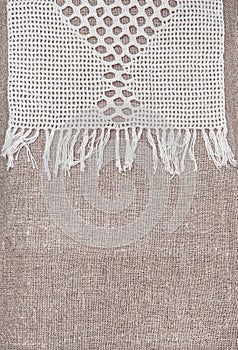 Vintage lace fabric border on the old burlap textile