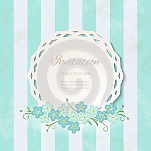 Vintage lacy frame on blue striped background with forget-me-not flowers.