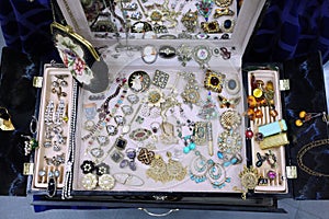 Vintage, ladies ` handbag and jewelry in a huge jewelry suitcase