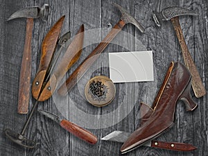 Vintage ladies shoe and shoemakers tools photo