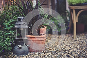 Vintage lamp. A garden decoration of an antique hand carried lamp photo