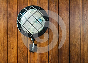 Vintage lamp on old sailboat wooden wall