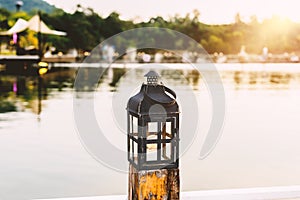 Vintage lamps on wooden pole in evening day