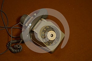 Vintage landline phone on brown carpet