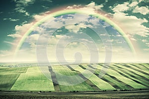 Vintage Landscape with Fields and Rainbow