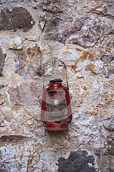 Vintage lantern lamp on stone wall