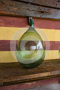 Vintage large wine bottles. Wine cellar, storage of wine.