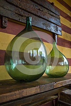 Vintage large wine bottles. Wine cellar, storage of wine.