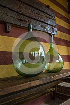 Vintage large wine bottles. Wine cellar, storage of wine.