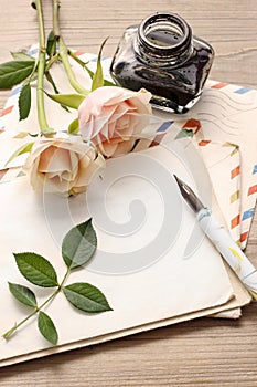 Vintage letters, roses and bottle of ink
