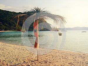 Vintage light effected: Beach umbrella exotic decoration with coconut tree