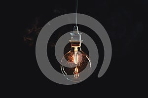 Vintage lightbulb on dark background