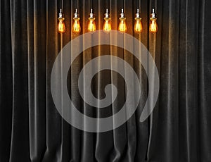 Vintage lightbulbs on velvet curtains background