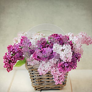 Vintage Lilac Flowers Bouquet in Wisker Basket photo