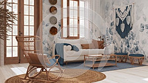 Vintage living room in boho chic style in white and blue tones. Sofa and rattan rocking chair on jute carpet. Bohemian interior