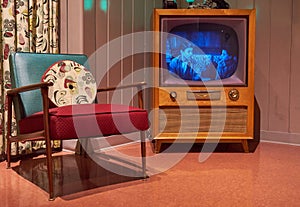 Vintage TV and Chair with leave it to beaver on the TV