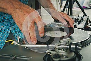 Vintage look deejay with vinyl in hands