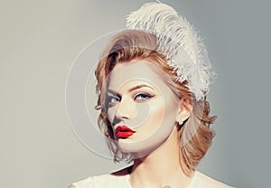 Vintage look. Retro woman. Pinup makeup. Sensual blond girl with elegant makeup, vintage style.