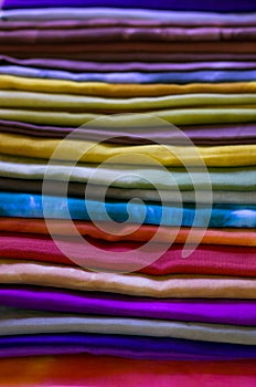 Vintage look of a stack of silky scarfs