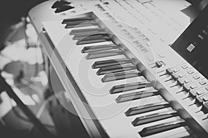 Vintage looking Detail of black and white keys on music keyboard