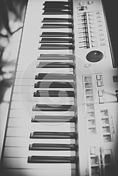 Vintage looking Detail of black and white keys on music keyboard