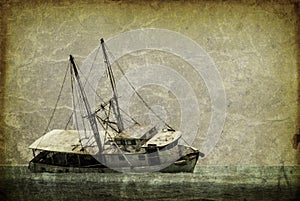 Vintage looking picture of a capsized fishing boat in the caribbean