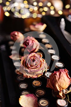 Vintage love with dried roses and typewriter