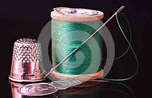 Vintage Needle and Thread on dark background