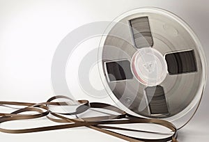 Vintage magnetic audio reel and tangled tape