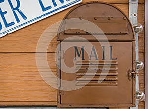 Vintage mailbox on wood wall