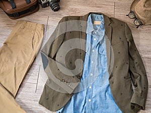 Vintage male clothing and accessories on the wooden background