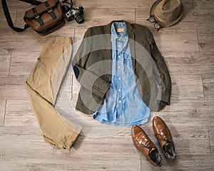 Vintage male clothing and accessories on the wooden background photo