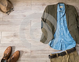 Vintage male clothing and accessories on the wooden background photo