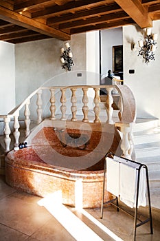 Vintage marble bathroom with towels and stairs