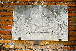 Vintage marble sign on brick wall