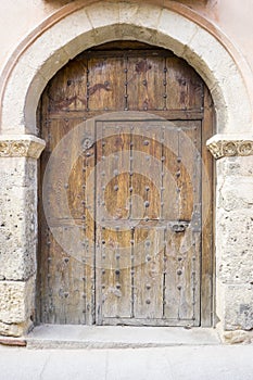 Vintage, medieval door Spanish city of Segovia. Old wooden entra photo