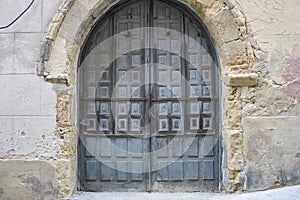 Vintage, medieval door Spanish city of Segovia. Old wooden entra photo