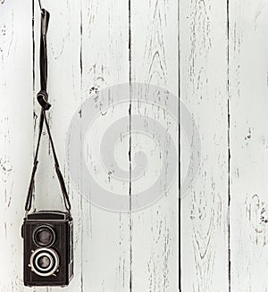 Vintage medium format photo Camera on the wooden batten wall