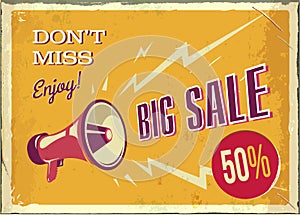 vintage megaphone. Big sale poster with grunge texture. Retro megaphone on the orange background with place for text.