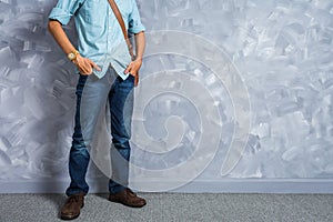 Vintage men clothings retro style with low key lighting over loft concrete wall background. photo