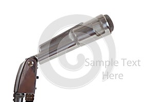Vintage metal microphone on white with copy space