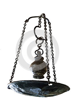 Vintage metal oil lamp on corroded chain isolated