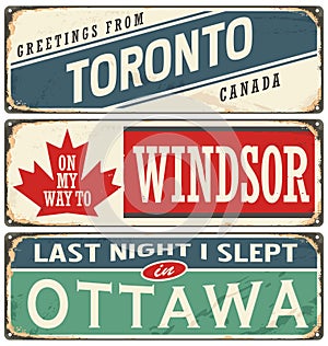 Vintage metal signs collection with Canada cities.