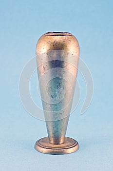 Vintage metal silver wine goblet cup on blue background