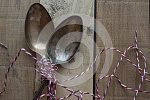 Vintage metal spoons, on wooden background photo