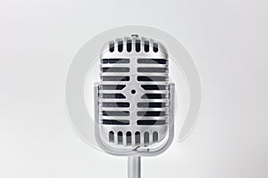 The vintage microphone close up image on white background