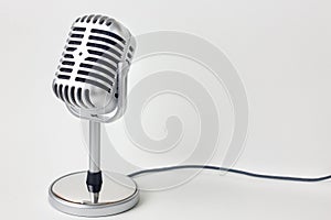 The vintage microphone close up image on white background